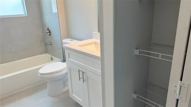 a bathroom with a sink toilet and bathtub