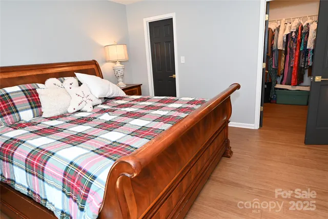 a bedroom with a bed and a table in it