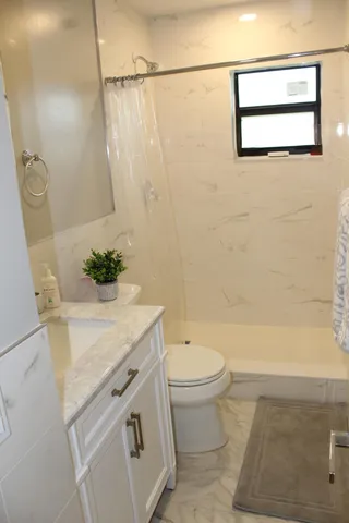 a bathroom with a sink a toilet and a bathtub