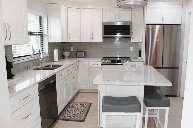 a kitchen with a sink stove and refrigerator