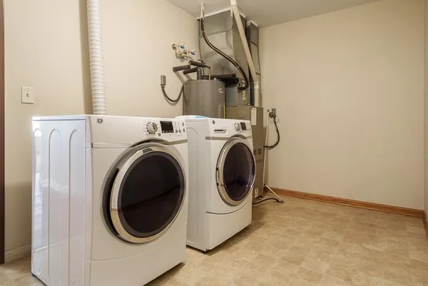a utility room with dryer and washer