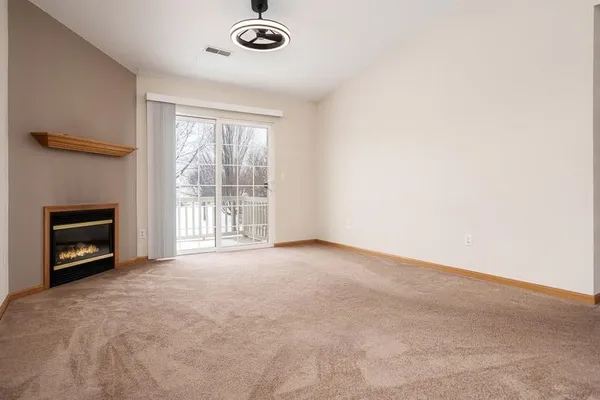 an empty room with a fireplace