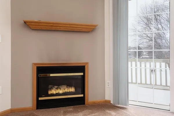 a room with a fireplace and a fireplace