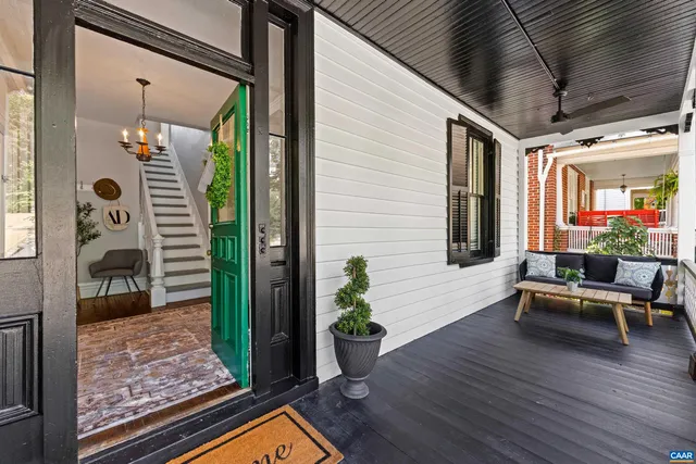 a view of a house with backyard and porch