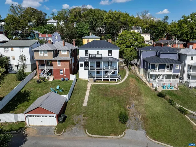 an aerial view of a house with a garden