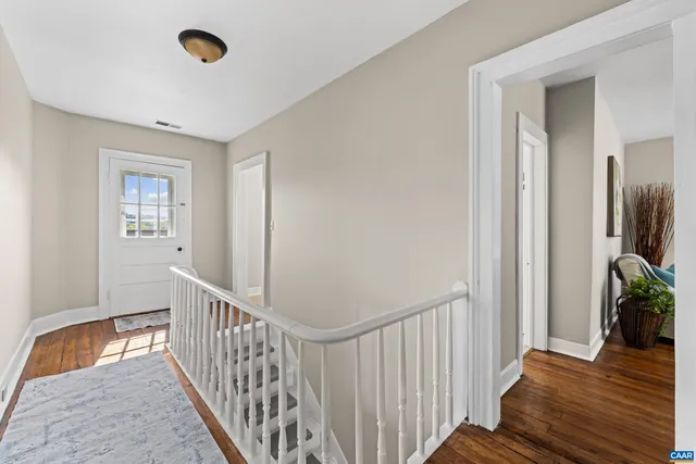 a view of entryway with wooden floor