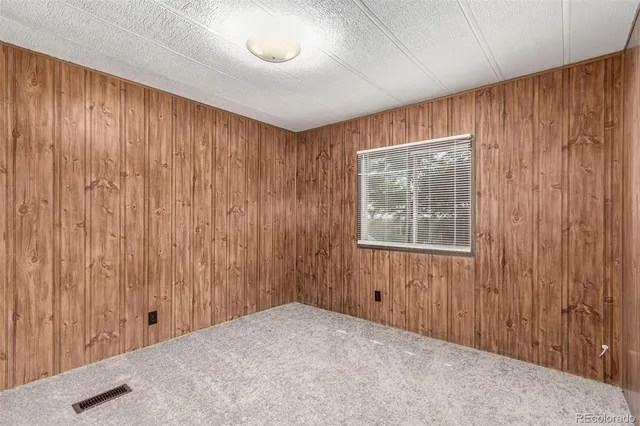 a view of a back yard with a wooden door