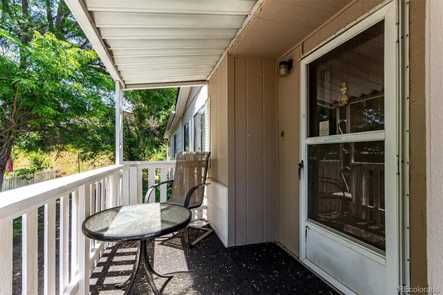 a view of a balcony and with furniture