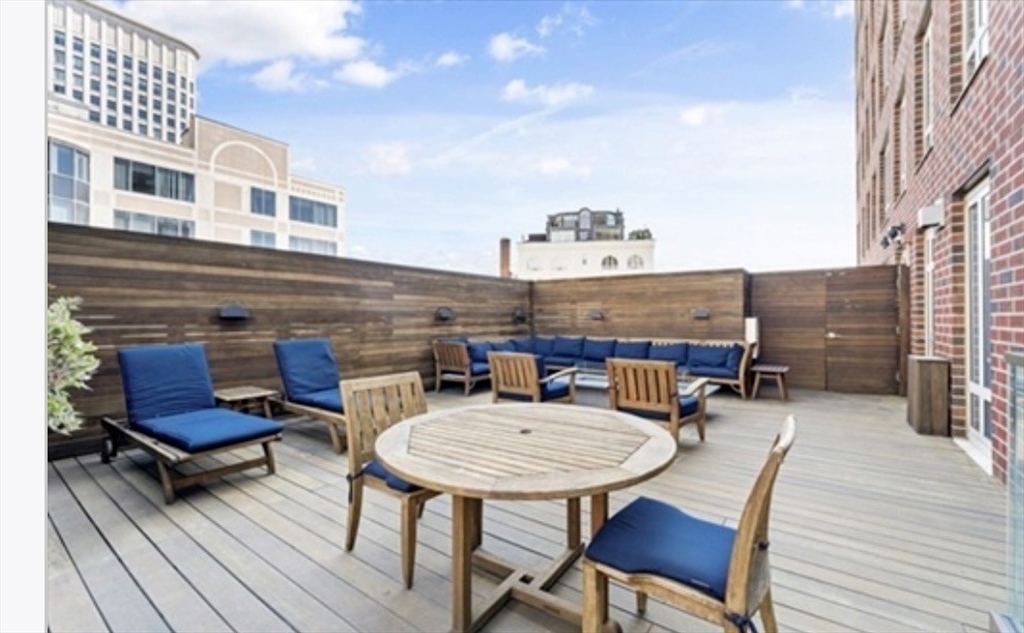 400 Stuart Street, Unit 18G Boston, MA 02116 - Photo 17 of 20 a view of a patio with table and chairs