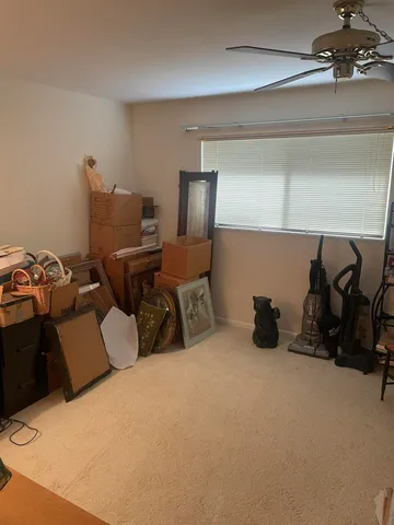 a bed room with furniture and a air conditioner vent