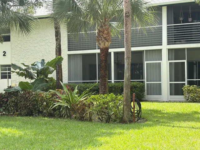 a view of a garden in front of a house