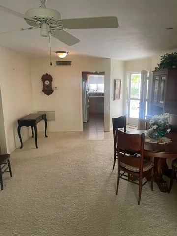 a view of a livingroom with furniture and a table