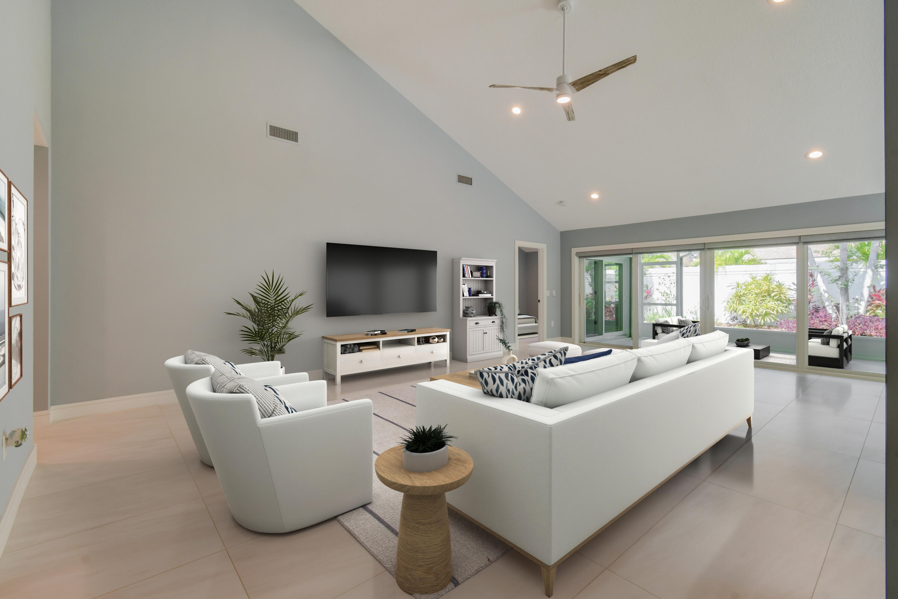 438 River Edge Road Jupiter, FL 33477 - Photo 13 of 80 a living room with furniture and a flat screen tv