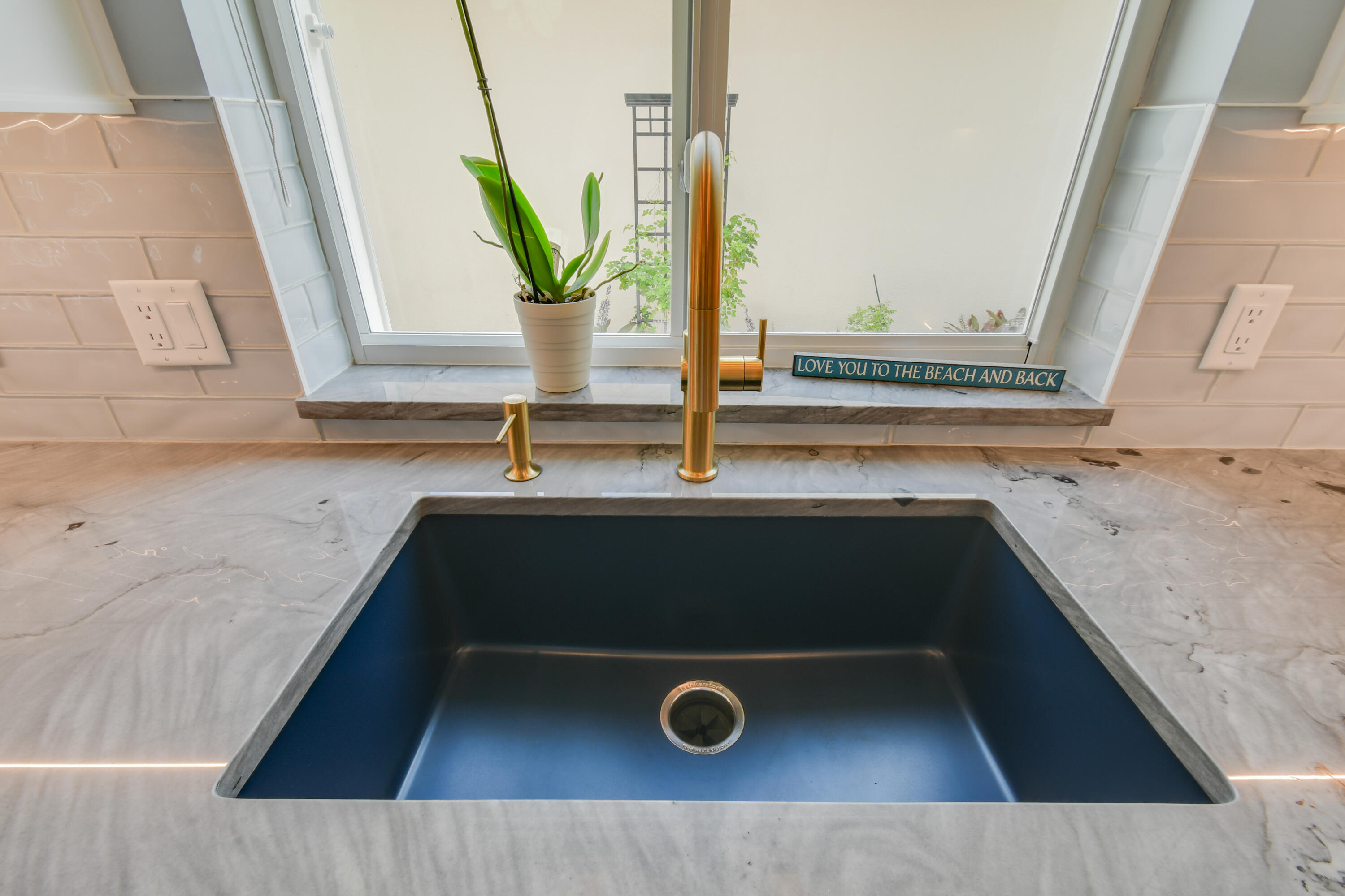 438 River Edge Road Jupiter, FL 33477 - Photo 23 of 80 a bathroom with a granite countertop sink and a mirror