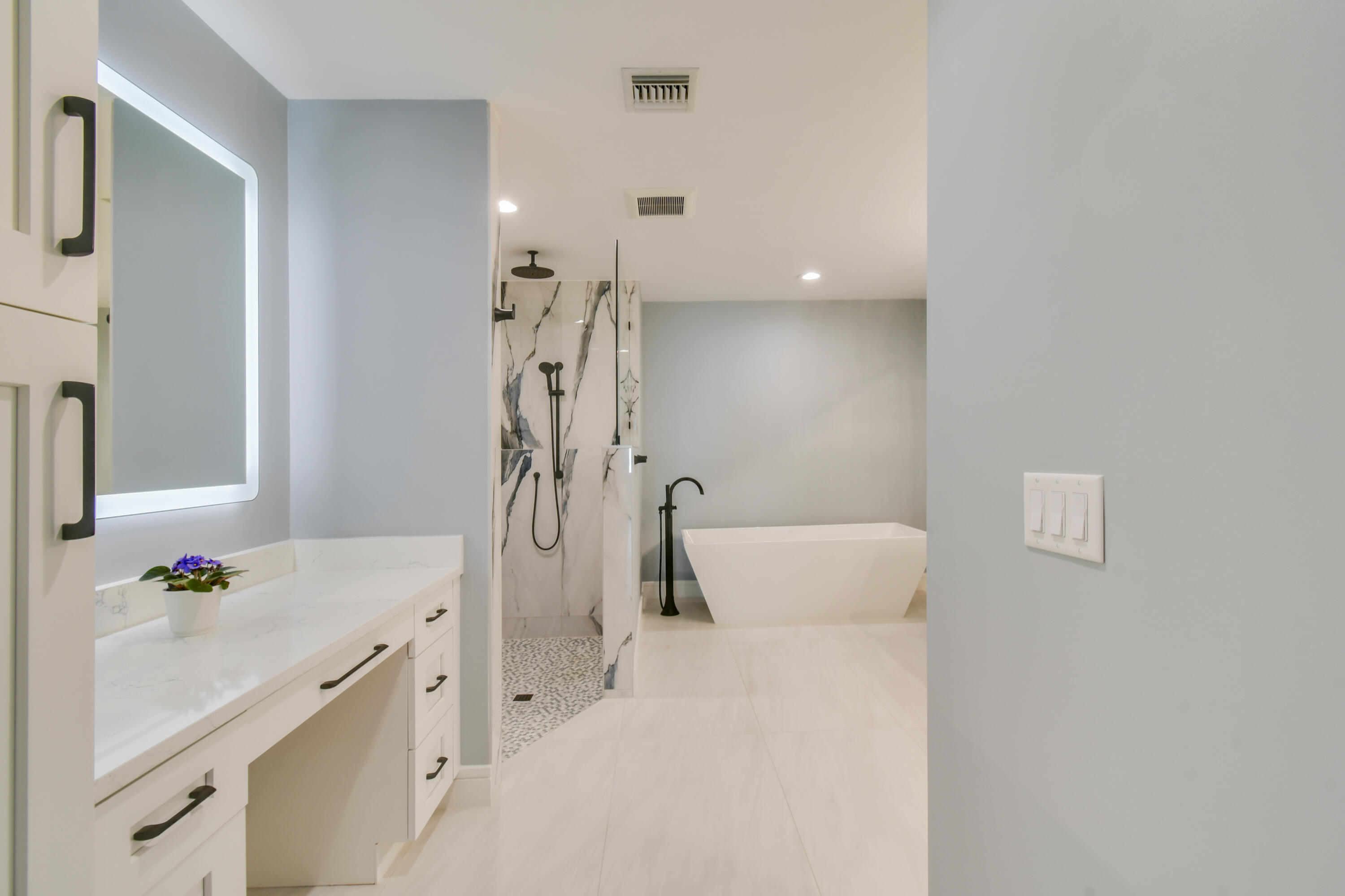 438 River Edge Road Jupiter, FL 33477 - Photo 32 of 80 a bathroom with a sink a toilet and shower