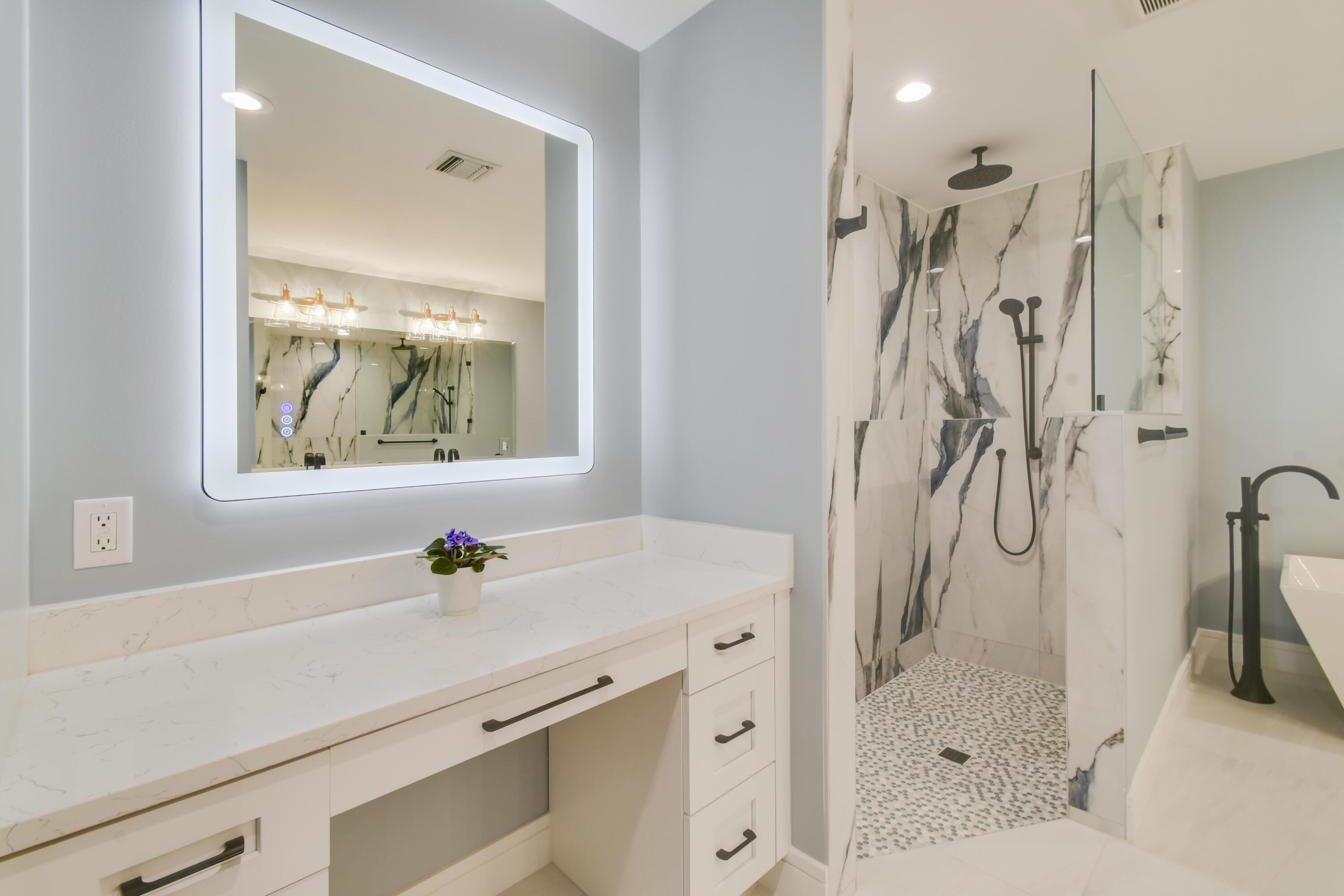 438 River Edge Road Jupiter, FL 33477 - Photo 33 of 80 a bathroom with a sink vanity granite tub and shower