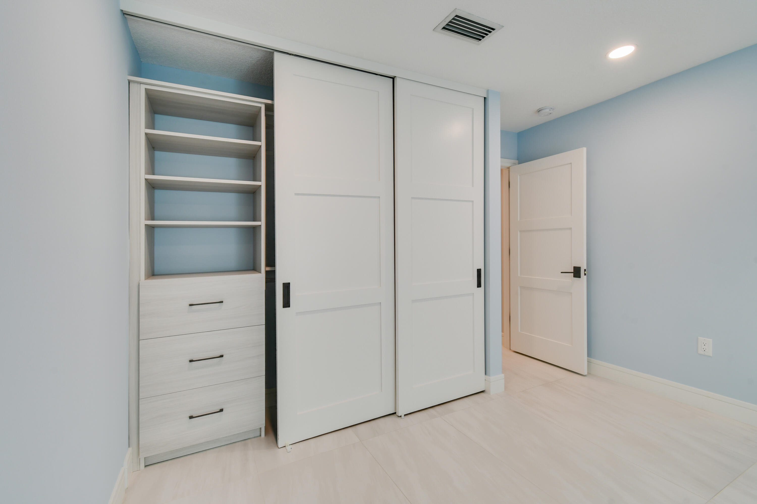 438 River Edge Road Jupiter, FL 33477 - Photo 43 of 80 a view of an empty walk in closet