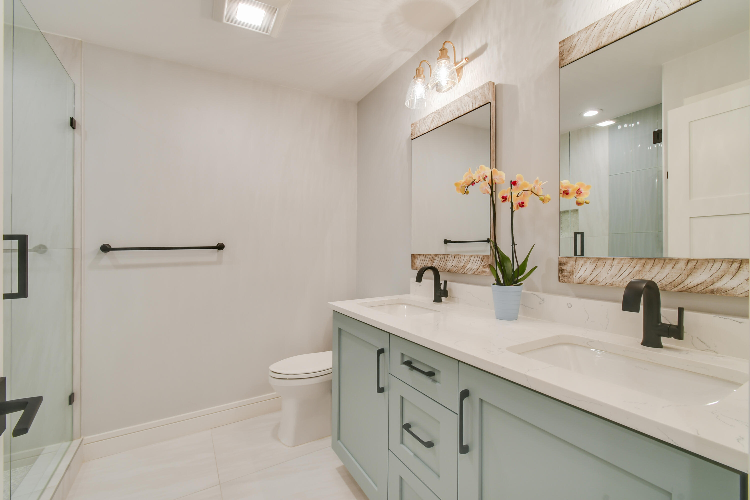 438 River Edge Road Jupiter, FL 33477 - Photo 45 of 80 a bathroom with a sink a toilet and shower