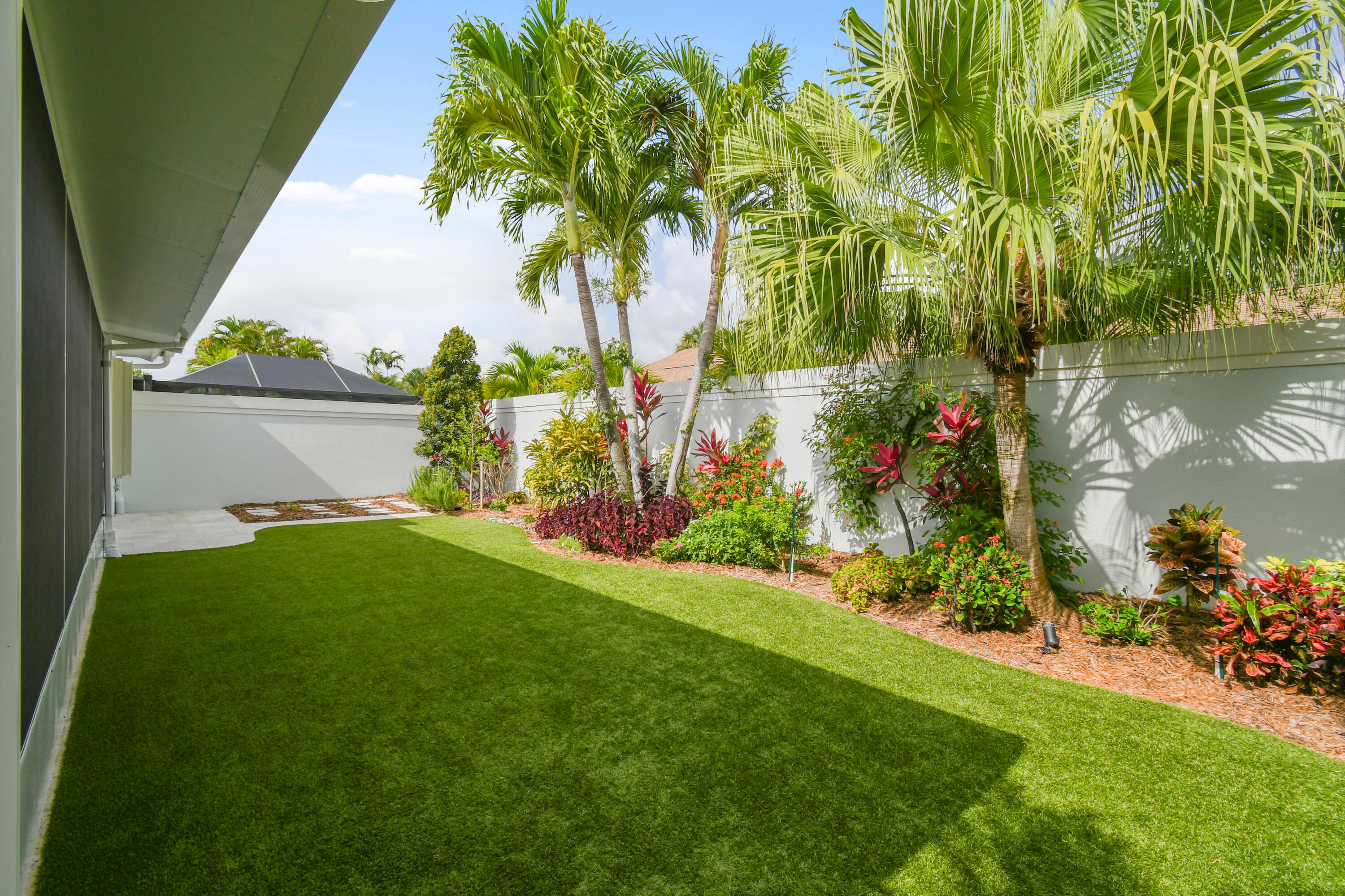 438 River Edge Road Jupiter, FL 33477 - Photo 52 of 80 Landscaped Rear Yard