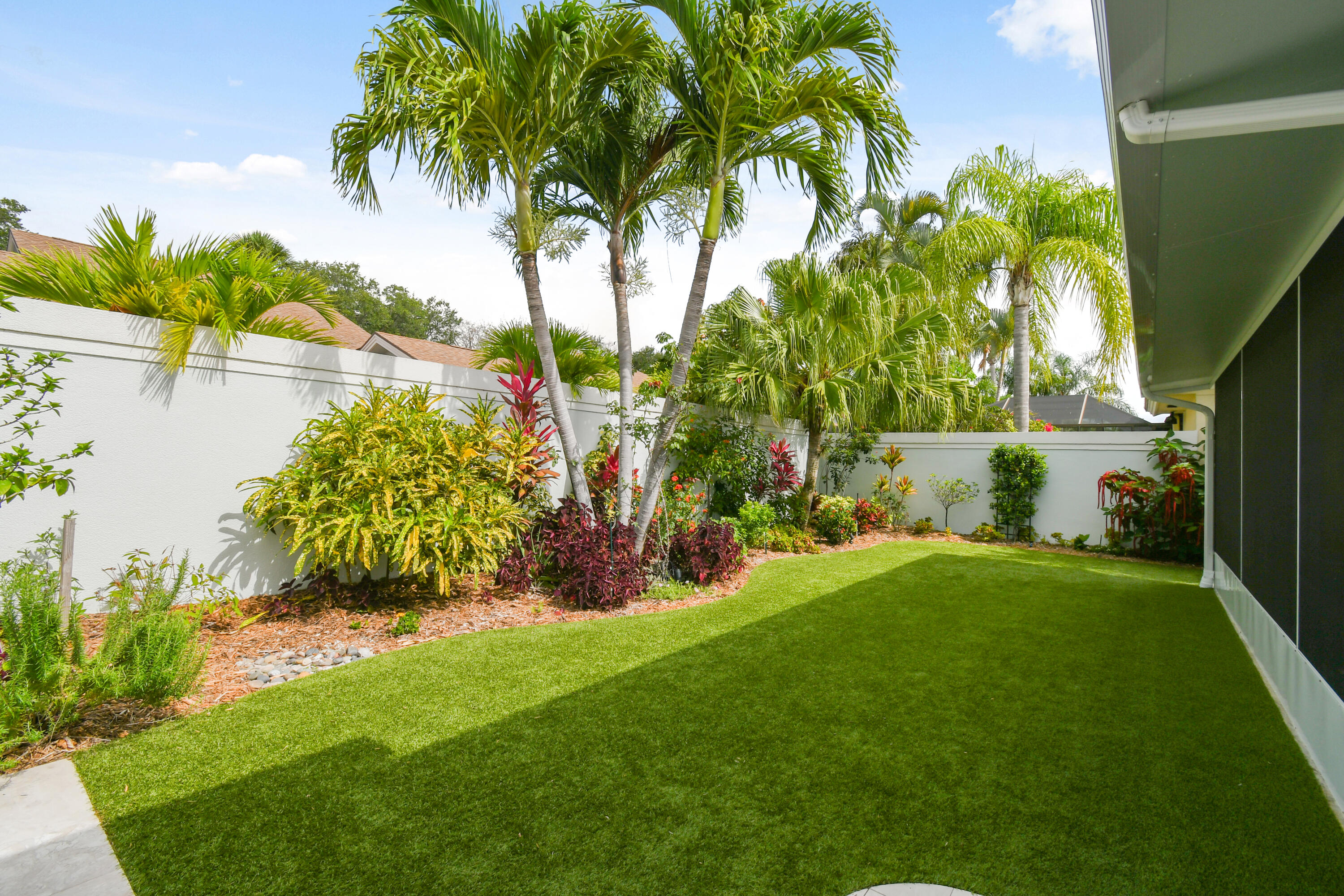 438 River Edge Road Jupiter, FL 33477 - Photo 56 of 80 a view of a garden with a tree