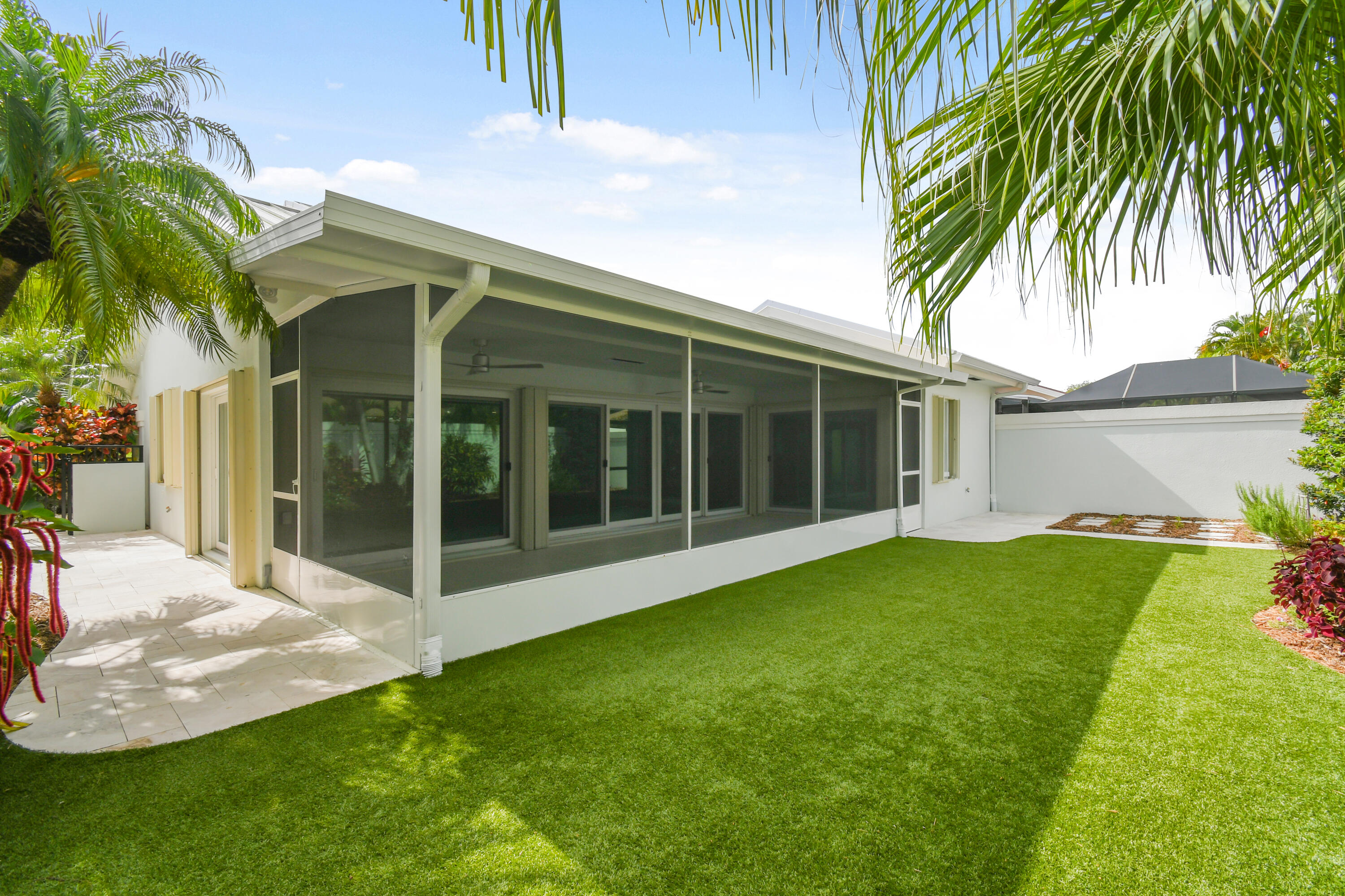 438 River Edge Road Jupiter, FL 33477 - Photo 58 of 80 a view of a house with a backyard
