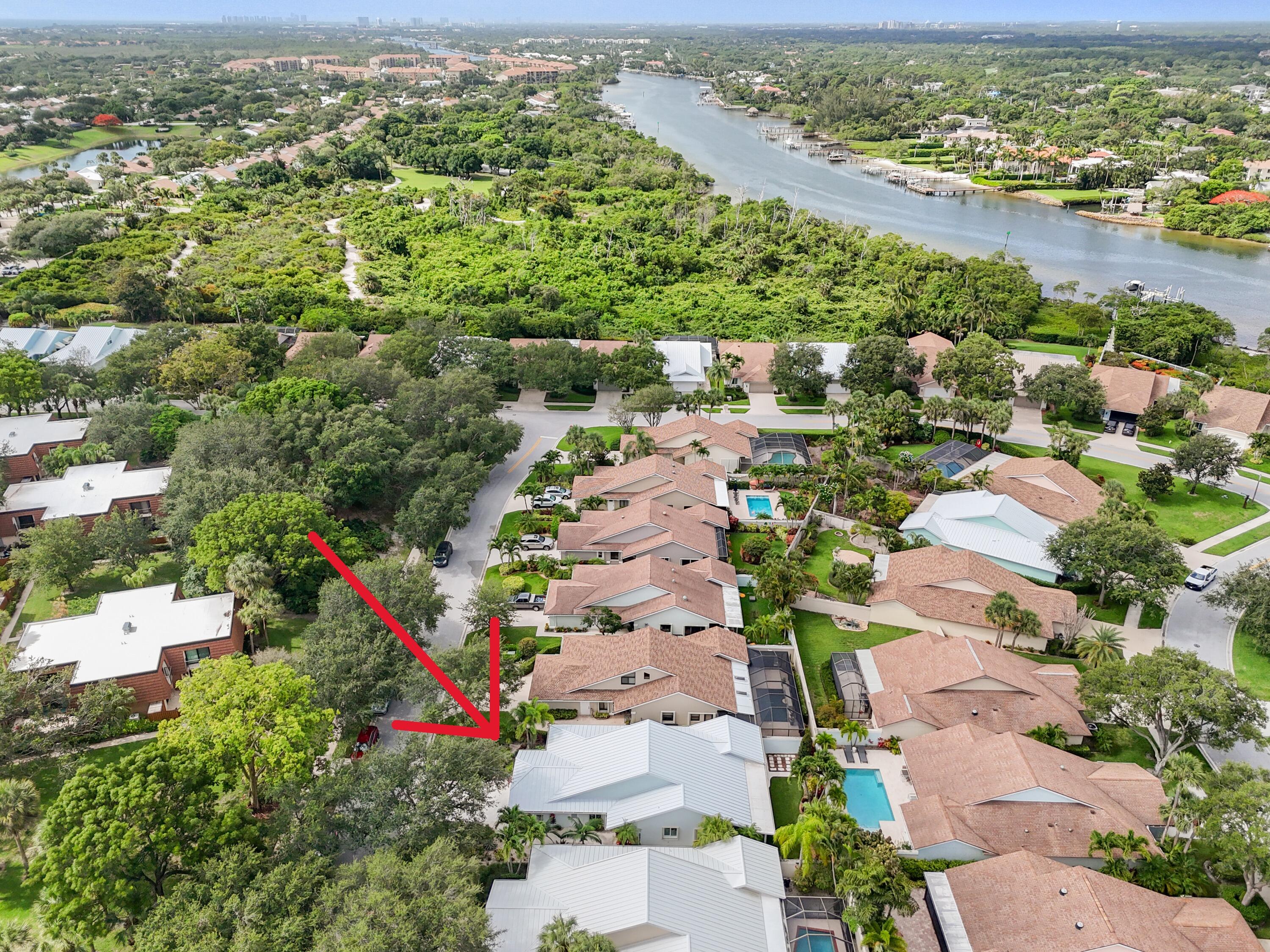 438 River Edge Road Jupiter, FL 33477 - Photo 64 of 80 an aerial view of residential houses with outdoor space