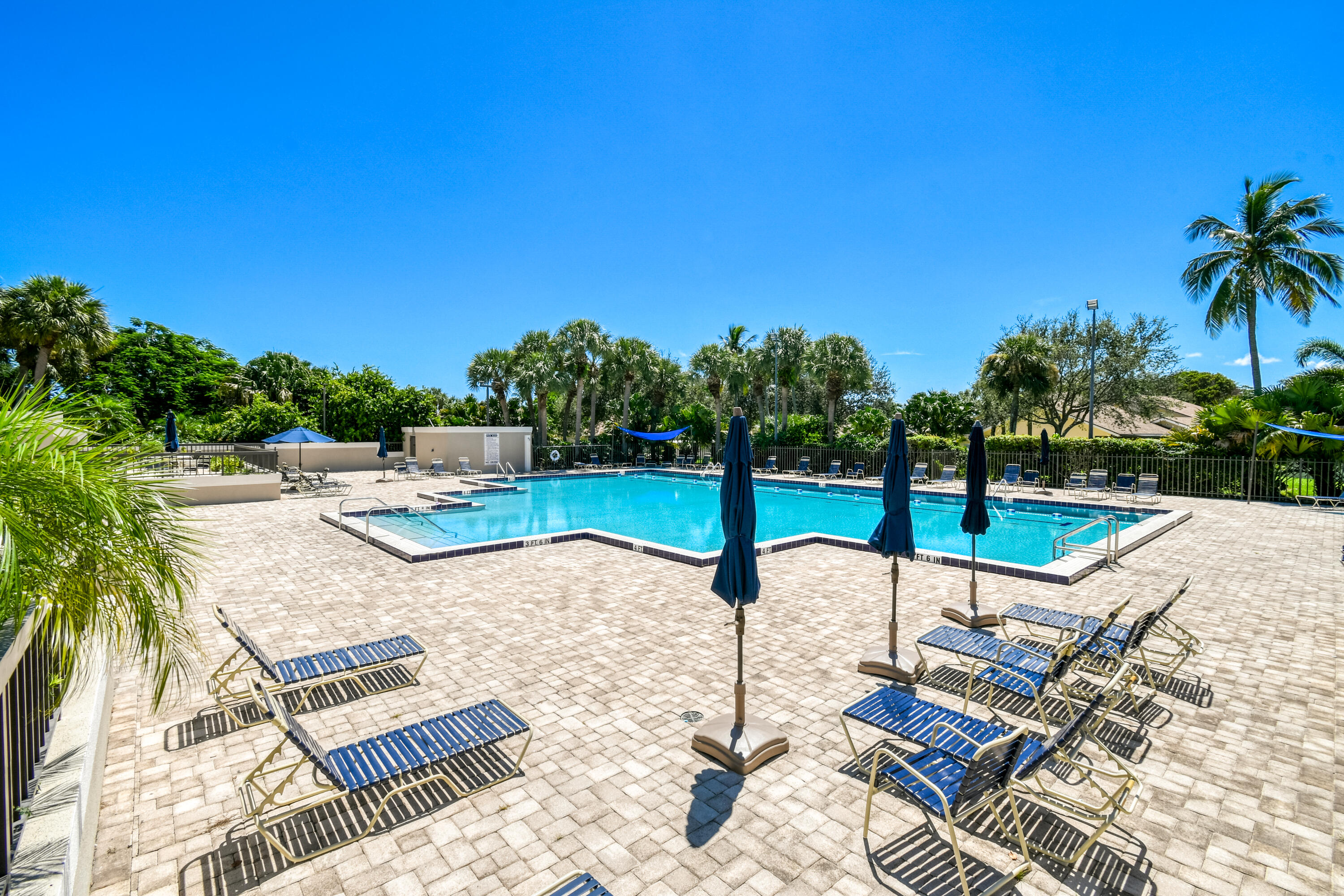 438 River Edge Road Jupiter, FL 33477 - Photo 69 of 80 a view of a backyard with swimming pool