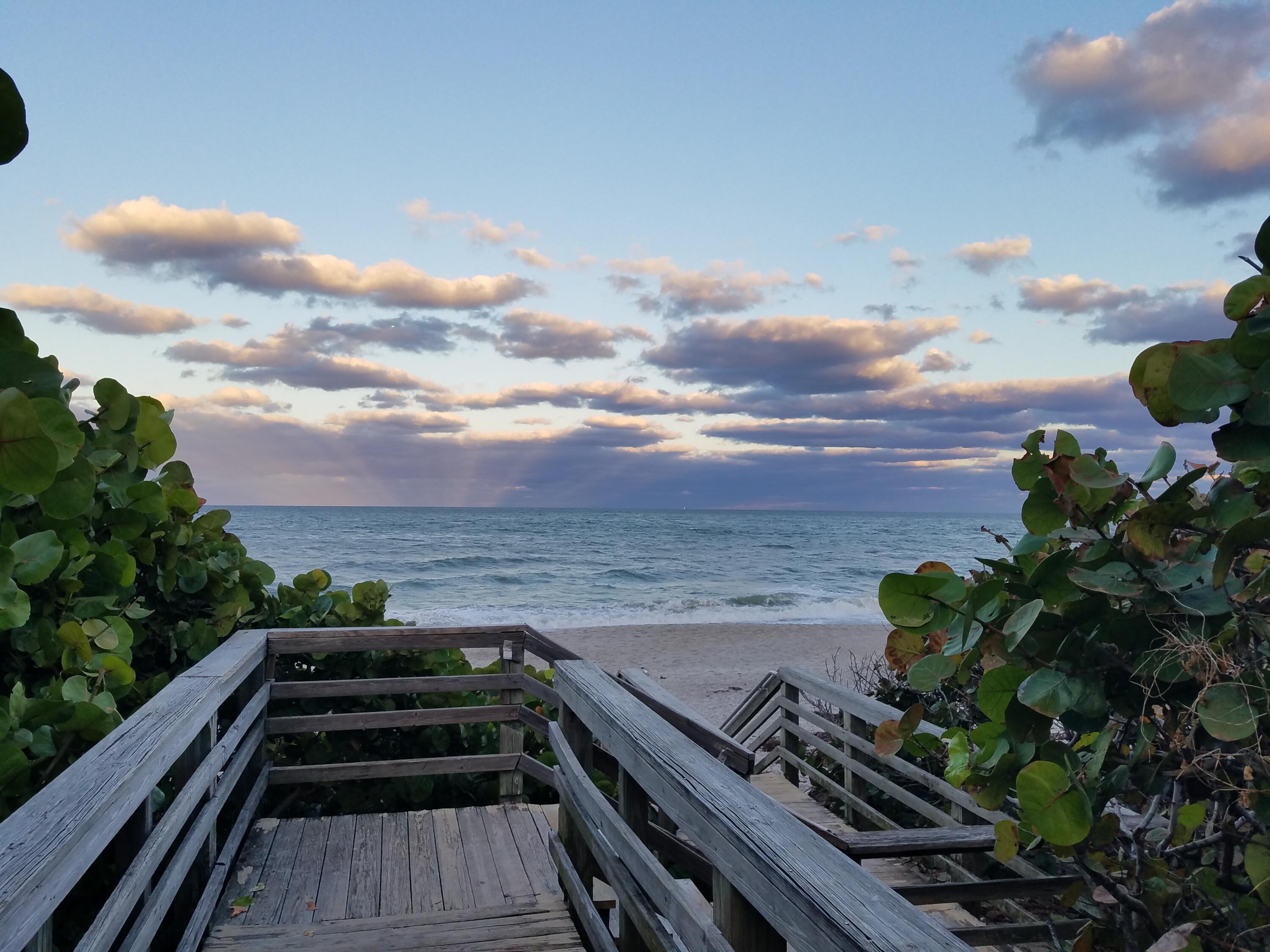 438 River Edge Road Jupiter, FL 33477 - Photo 79 of 80 a view of a terrace with wooden floor and city view