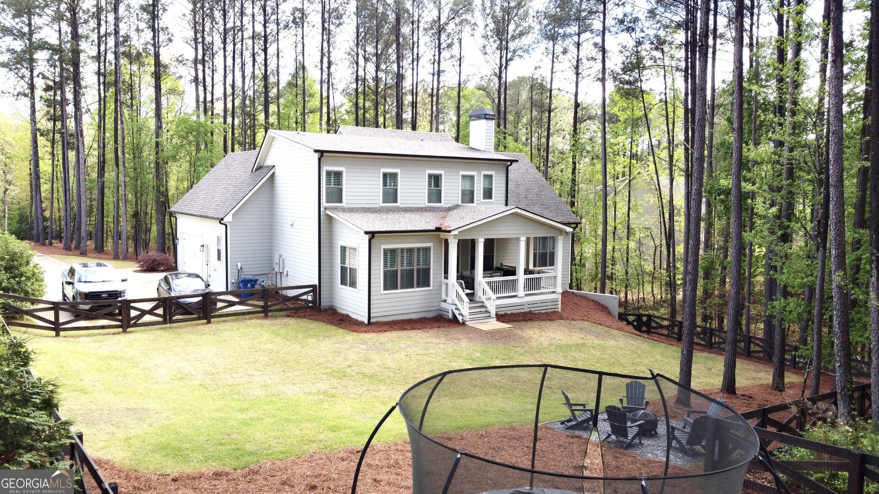 120 Spring Creek Drive Rutledge, GA 30663 - Photo 37 of 38 a view of a house with swimming pool and sitting area