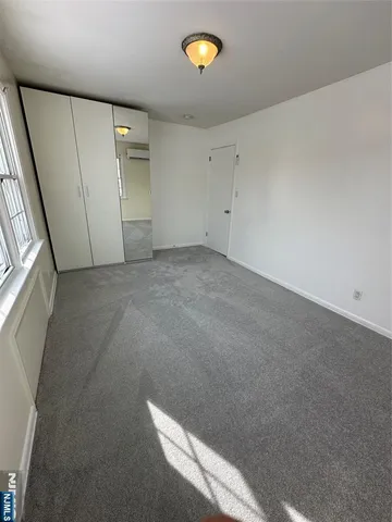 a view of a storage & utility room with a window