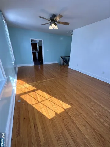 a view of a livingroom with wooden floor
