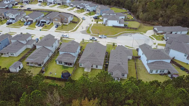 an aerial view of residential houses with swimming pool