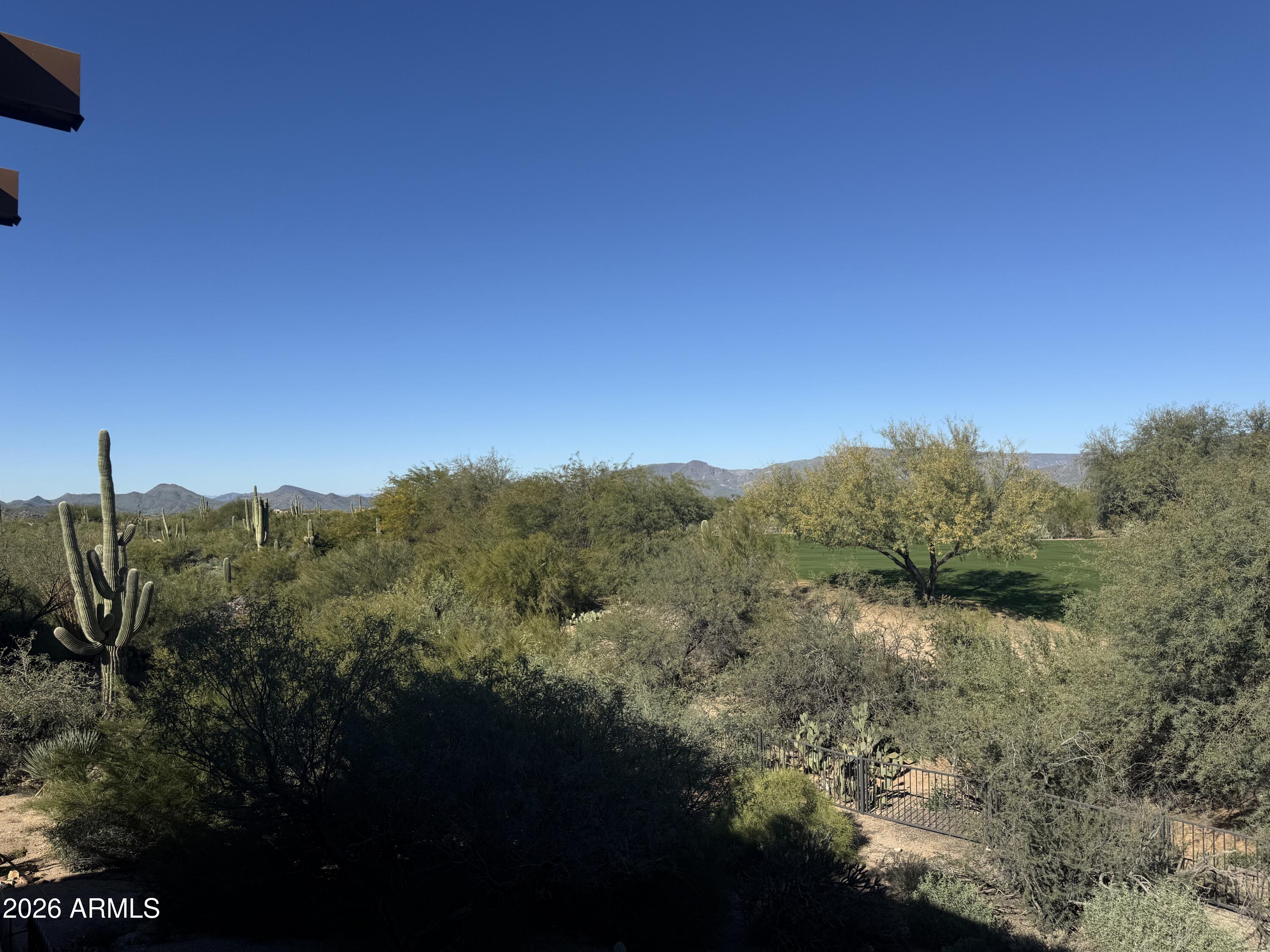 36601 North Mule Train Road, Unit D18 Carefree, AZ 85377 - Photo 17 of 57 a view of a mountain range with trees in the background