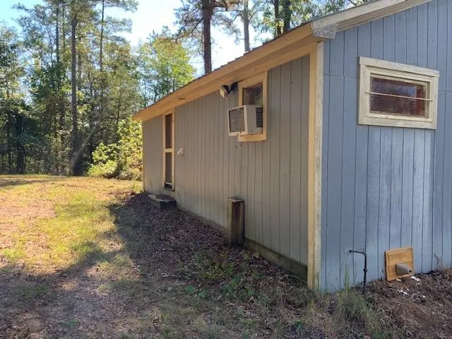 a backyard of a house with yard and outdoor seating
