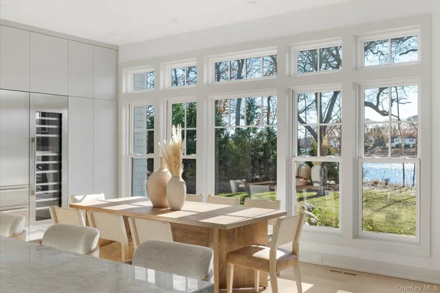 a view of a dining room with furniture window and outside view