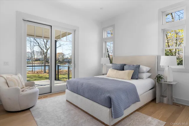 a bedroom with a bed and glass window