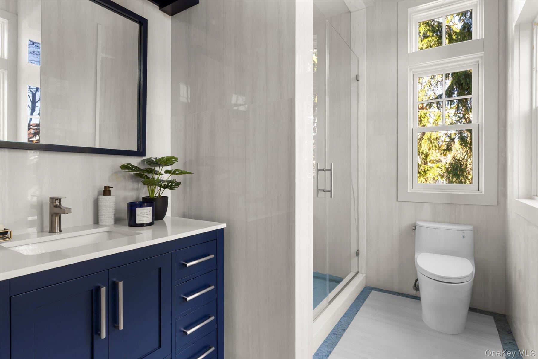 1750 Hobart Road Southold, NY 11971 - Photo 19 of 41 a bathroom with a granite countertop sink and a mirror