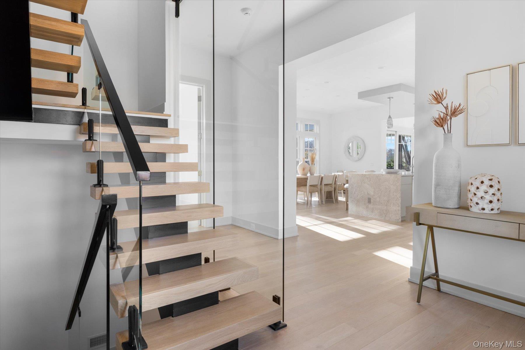 1750 Hobart Road Southold, NY 11971 - Photo 20 of 41 a view of entryway with bathroom and hall with wooden floor