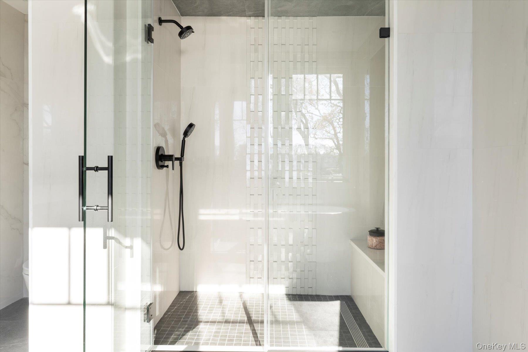 1750 Hobart Road Southold, NY 11971 - Photo 26 of 41 a bathroom with a glass shower door