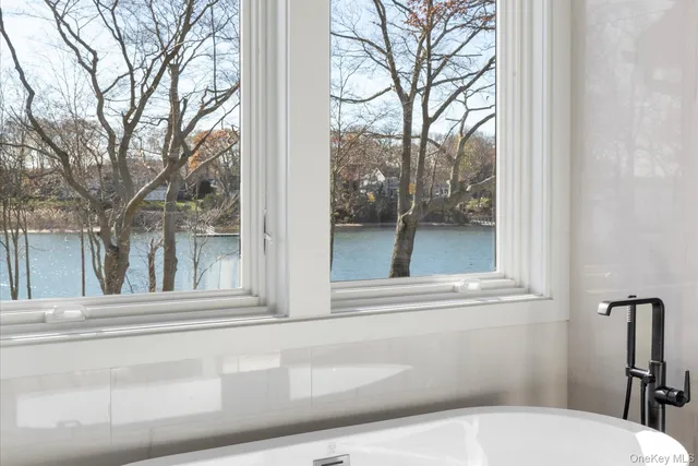 a view of a house with a window and back yard