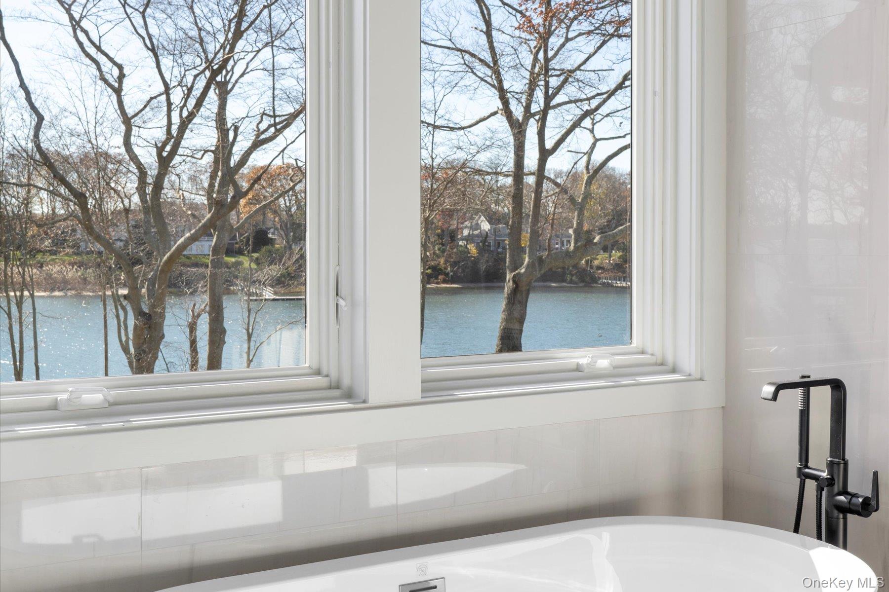 1750 Hobart Road Southold, NY 11971 - Photo 27 of 41 a view of a house with a window and back yard