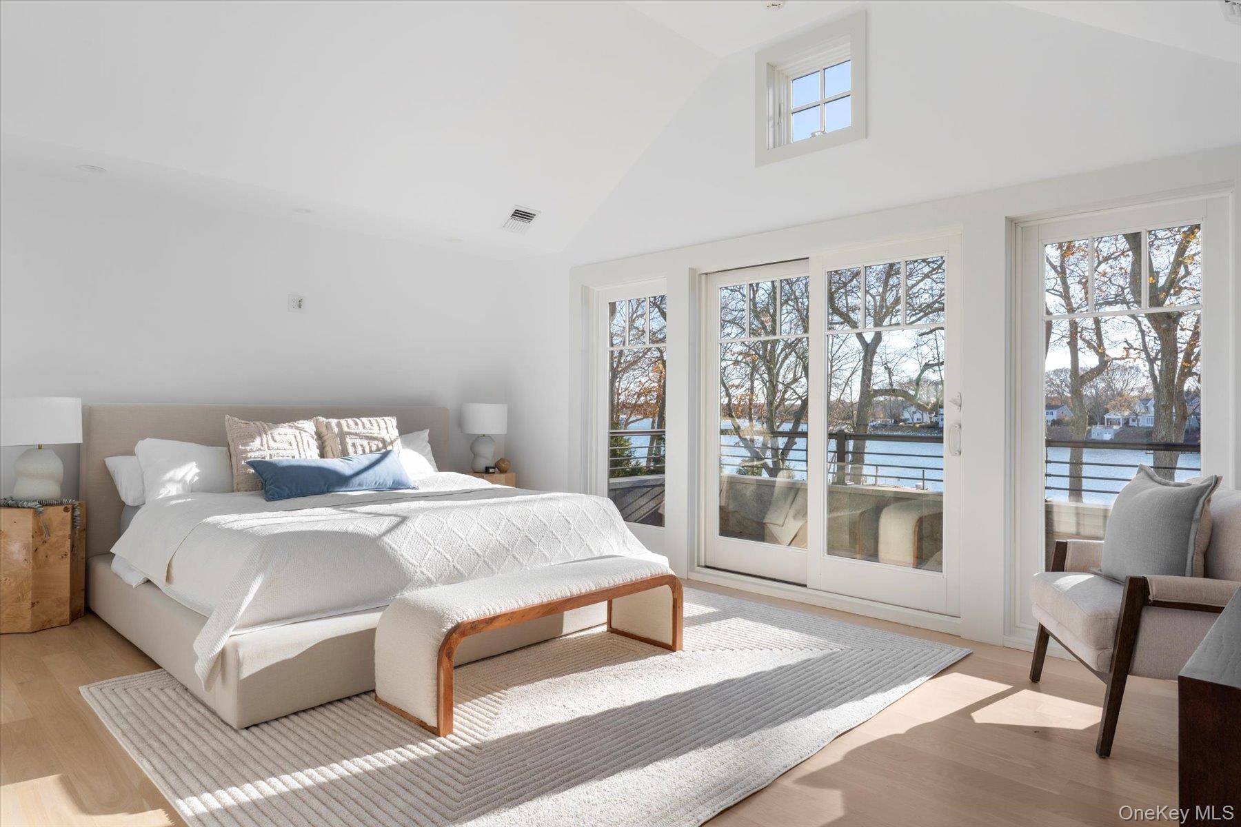 1750 Hobart Road Southold, NY 11971 - Photo 29 of 41 a bedroom with a large bed and a large window