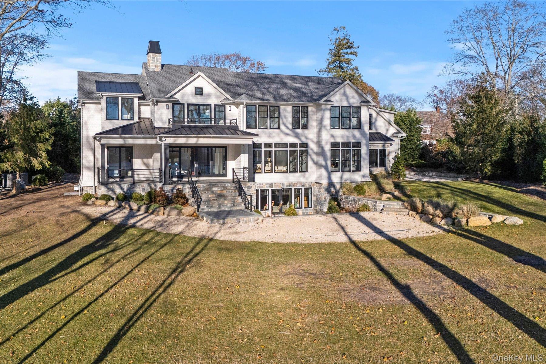 1750 Hobart Road Southold, NY 11971 - Photo 36 of 41 a front view of a house with swimming pool