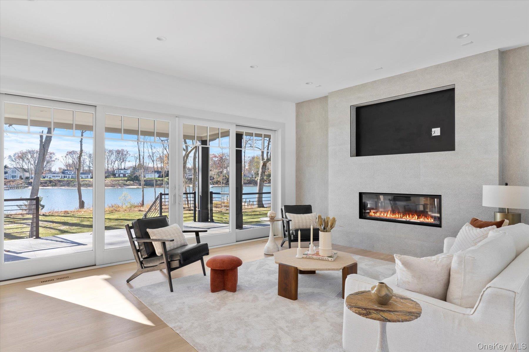 1750 Hobart Road Southold, NY 11971 - Photo 6 of 41 a living room with furniture and a fireplace