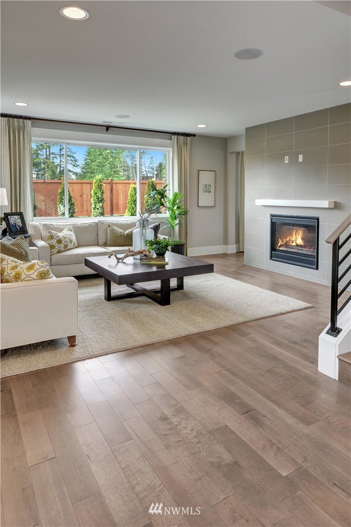 270 Field Place Southeast Renton, WA 98059 - Photo 6 of 20 a living room with furniture and a fireplace