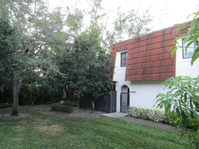 a backyard of a house with lots of green space