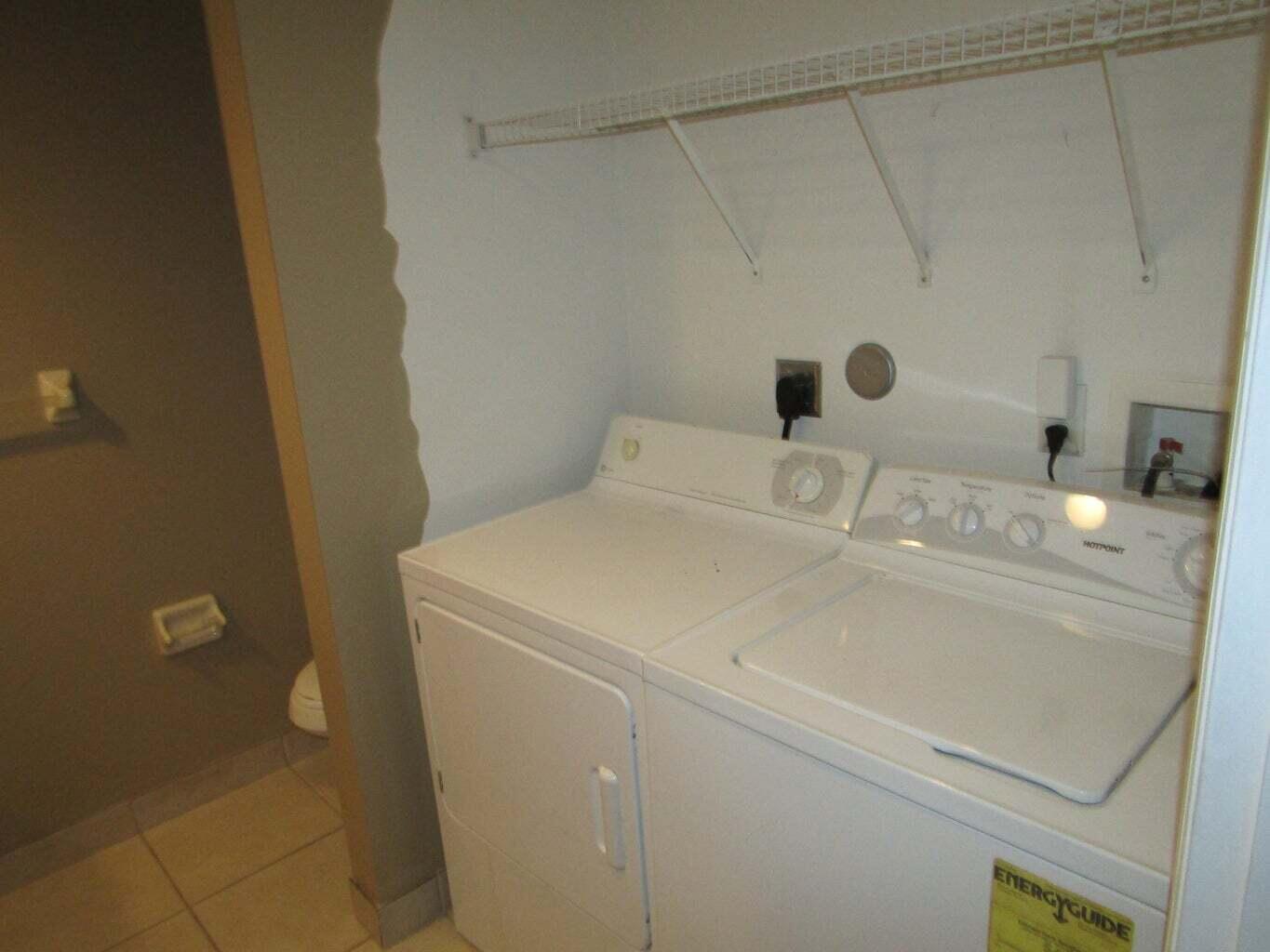 2212 White Pine Circle, Unit B Greenacres, FL 33415 - Photo 9 of 9 a bathroom with a sink and a mirror