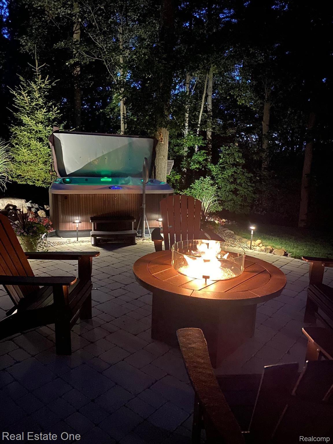 9091 Northpointe Ridge Brighton, MI 48114 - Photo 48 of 56 Enjoy a relaxing evening in your Jacuzzi hot tub.
