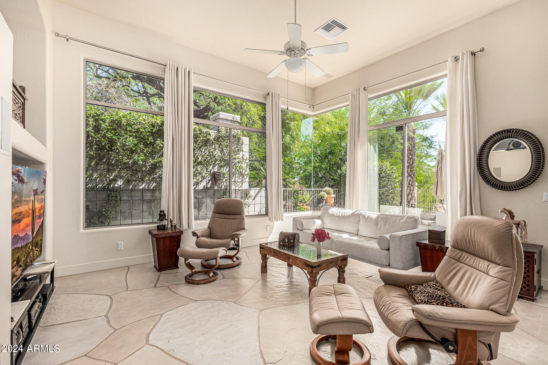 6437 North 28th Street Phoenix, AZ 85016 - Photo 11 of 53 a living room with furniture and a large window