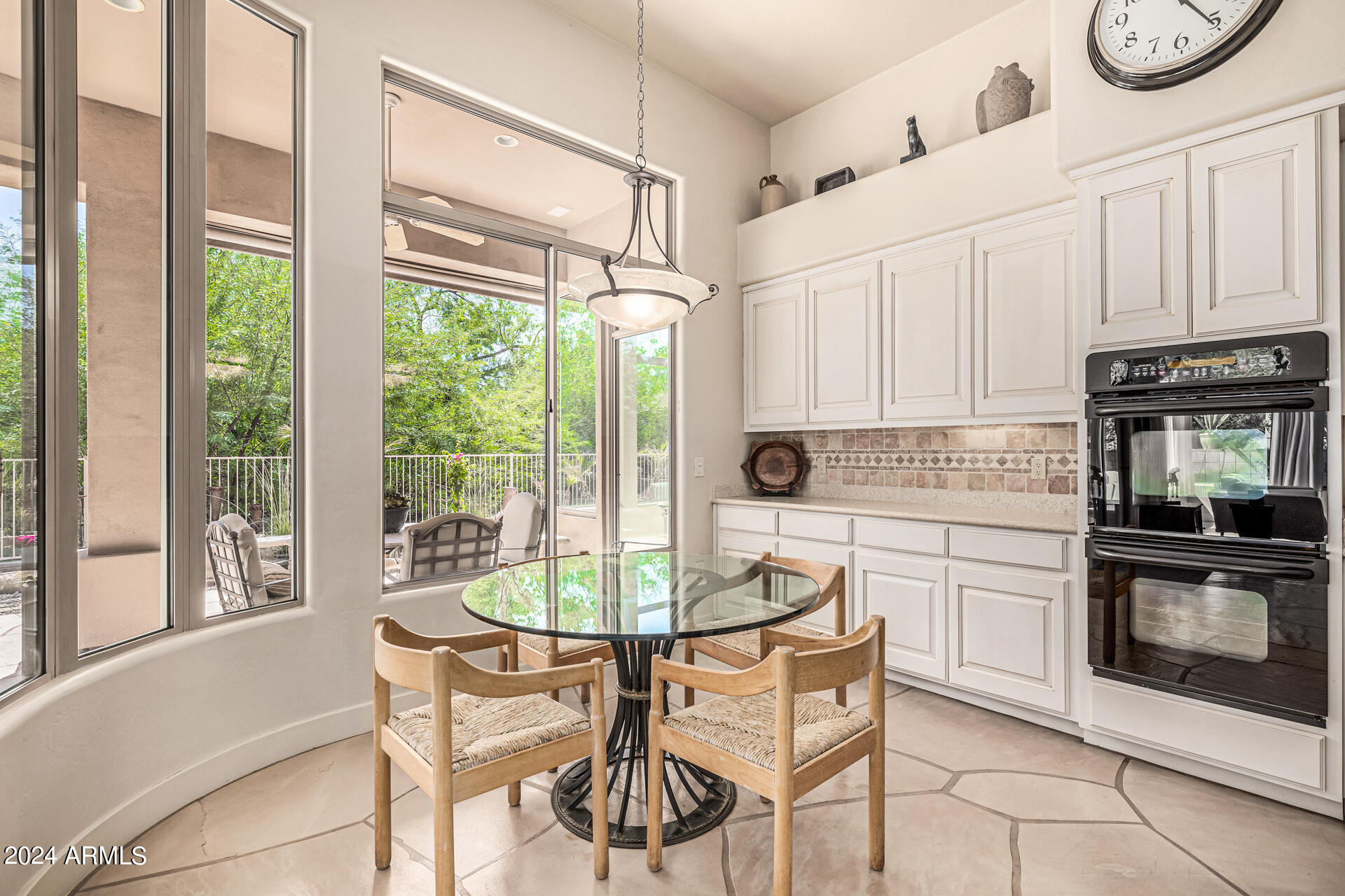 6437 North 28th Street Phoenix, AZ 85016 - Photo 17 of 53 a kitchen with a table chairs and a stove